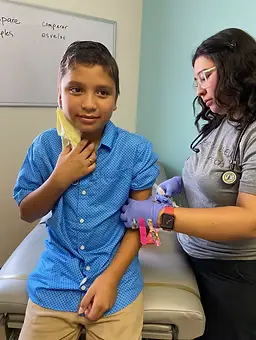 Child receiving a vaccine at Lirios Pediatrics