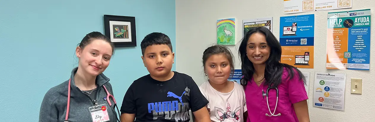 Lirios Pediatrics staff with young patients